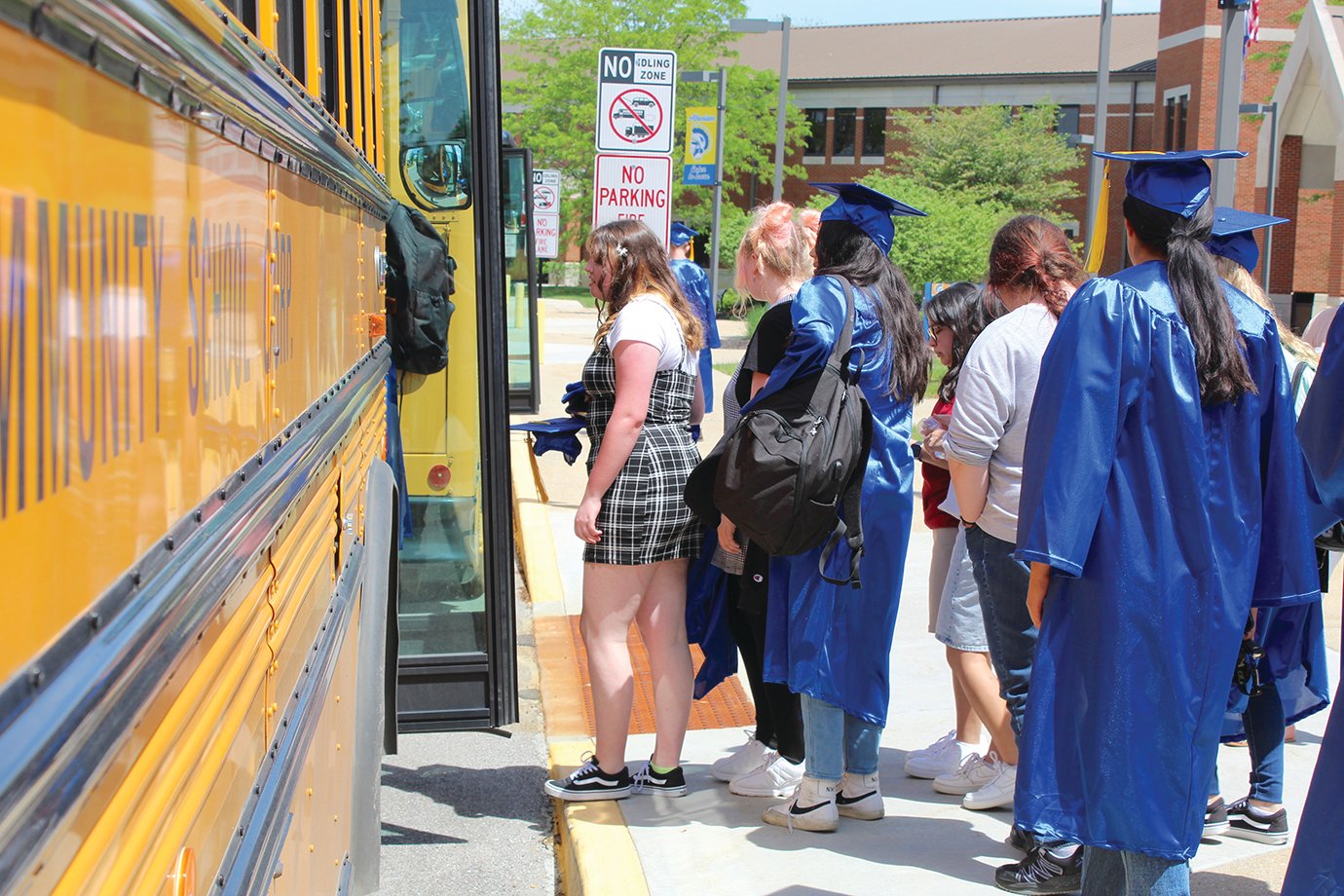 Nearly 160 seniors board four buses at Crawfordsville High School on Tuesday as they depart for the district elementary schools for the Senior Walk.